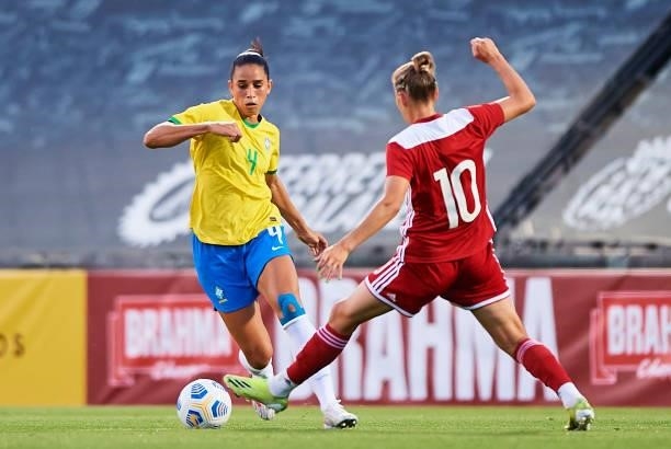 Rafaelle Souza of Brazil competes for the ball with Nadezhda Smirnova of Russia during the Women's International friendly match between Brazil and...