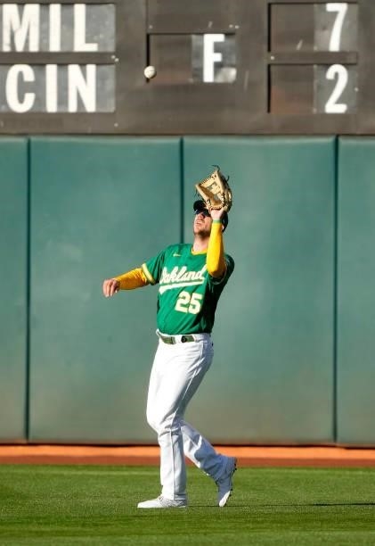 Stephen Piscotty of the Oakland Athletics catches a fly ball off the bat of Hunter Dozier of the Kansas City Royals in the top of the second inning...