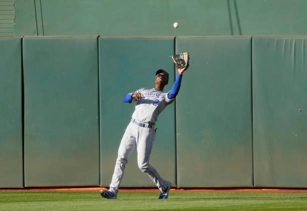 Michael A. Taylor of the Kansas City Royals catches a fly ball off the bat of Jed Lowrie of the Oakland Athletics in the bottom of the first inning...