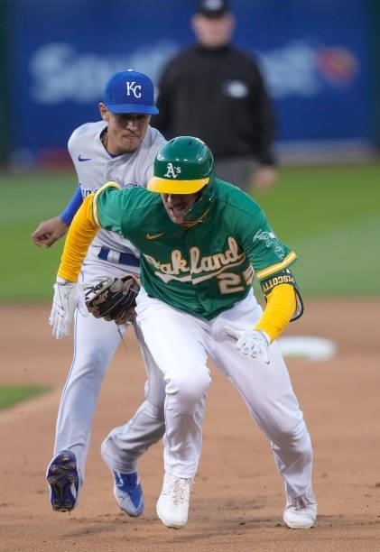 Stephen Piscotty of the Oakland Athletics gets caught in a rundown and tagged out by Nicky Lopez of the Kansas City Royals in the bottom of the fifth...