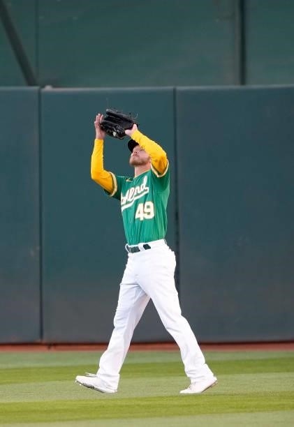 Skye Bolt of the Oakland Athletics catches a fly ball off the bat of Carlos Santana of the Kansas City Royals in the top of the third inning at...