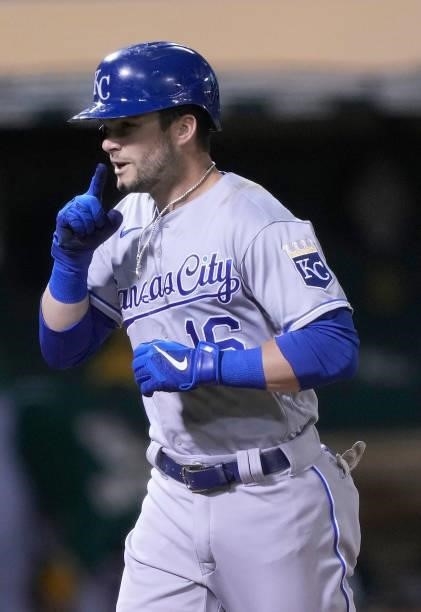 Andrew Benintendi of the Kansas City Royals celebrates after hitting a solo home run against the Oakland Athletics in the top of the eighth inning at...