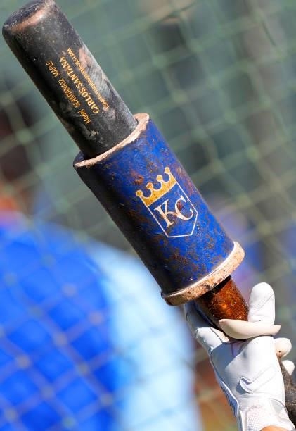 Detailed view of a bat belonging to Carlos Santana of the Kansas City Royals with the Royals bat weight on the end during batting practice prior to...