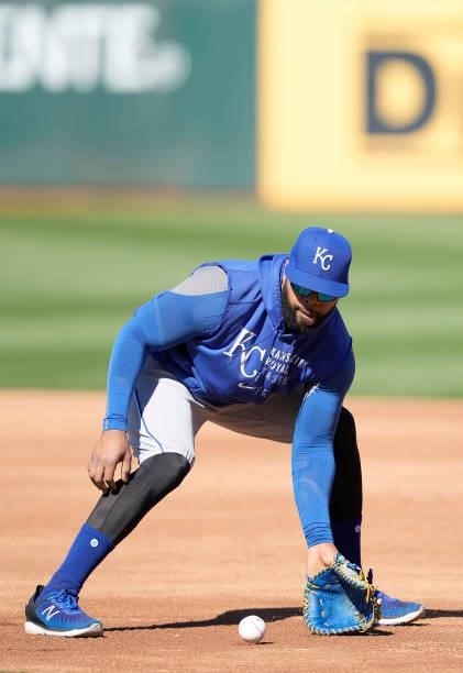 Carlos Santana of the Kansas City Royals fields ground balls prior to the start of his game against the Oakland Athletics at RingCentral Coliseum on...