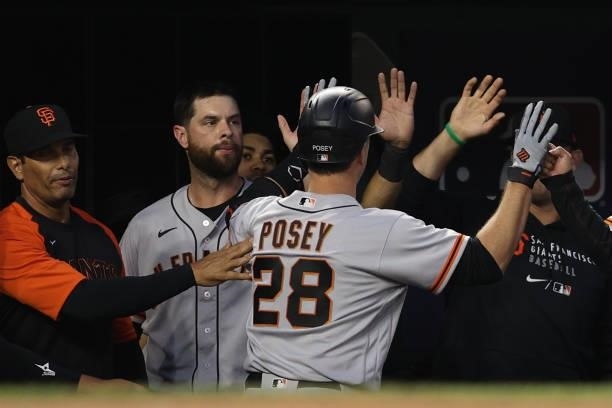 Buster Posey of the San Francisco Giants celebrates his home run against the Washington Nationals during the fourth inning at Nationals Park on June...