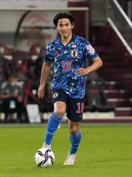 Takumi Minamino of Japan in action during the international friendly match between Japan and Serbia at Noevir Stadium Kobe on June 11, 2021 in Kobe,...