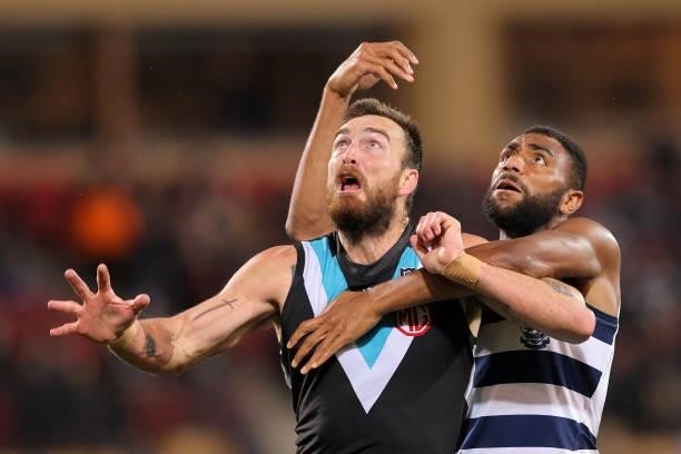 Charlie Dixon of the Power and Esava Ratugolea of the Cats competes for the ball during the round 13 AFL match between the Port Adelaide Power and...