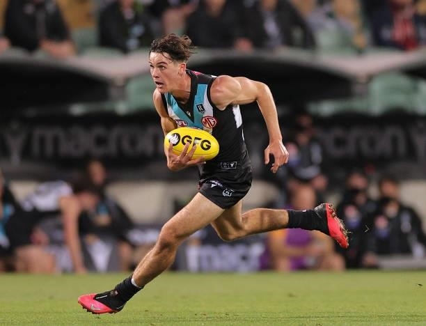 Connor Rozee of the Power runs with the ball during the round 13 AFL match between the Port Adelaide Power and the Geelong Cats at Adelaide Oval on...