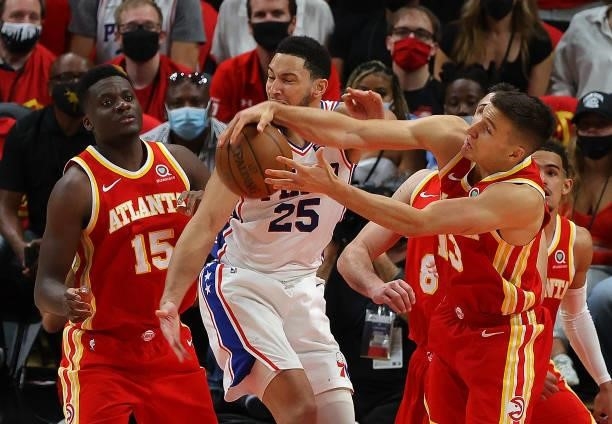 Ben Simmons of the Philadelphia 76ers battles for a rebound against Bogdan Bogdanovic of the Atlanta Hawks during the second half of game 3 of the...