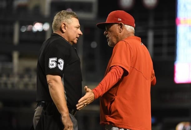 Manager Joe Madden of the Los Angeles Angels argues with home plate umpire Greg Gibson after Shohei Ohtani was called for a balk which scored Josh...