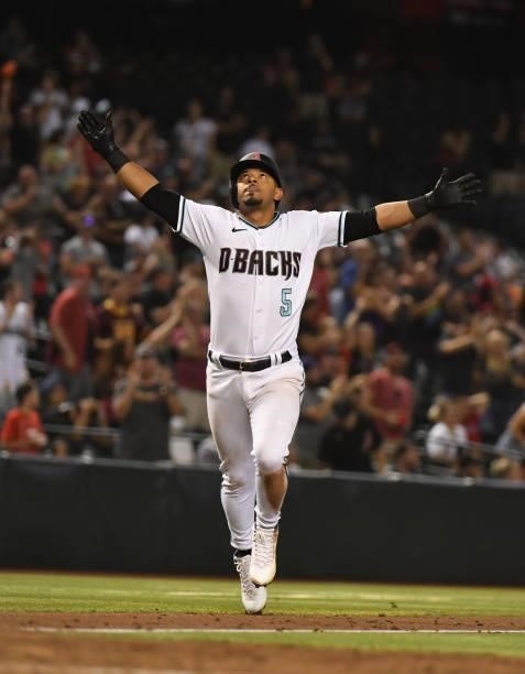 Eduardo Escobar of the Arizona Diamondbacks celebrates after hitting a game tying solo home run against the Los Angeles Angels during the ninth...
