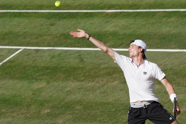 Ugo Humbert of France makes a service during his match against Felix Auger-Aliassime of Canada during day 5 of the MercedesCup at Tennisclub...