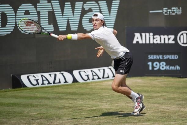 Ugo Humbert of France plays a backhand during his match against Felix Auger-Aliassime of Canada during day 5 of the MercedesCup at Tennisclub...