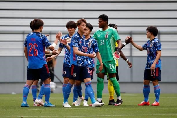 Japanese players celebrate after their 4-0 victory in the international friendly match between Japan U-24 and Jamaica at the Toyota Stadium on June...
