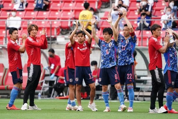 Japanese players applaud fans after their 4-0 victory in the international friendly match between Japan U-24 and Jamaica at the Toyota Stadium on...