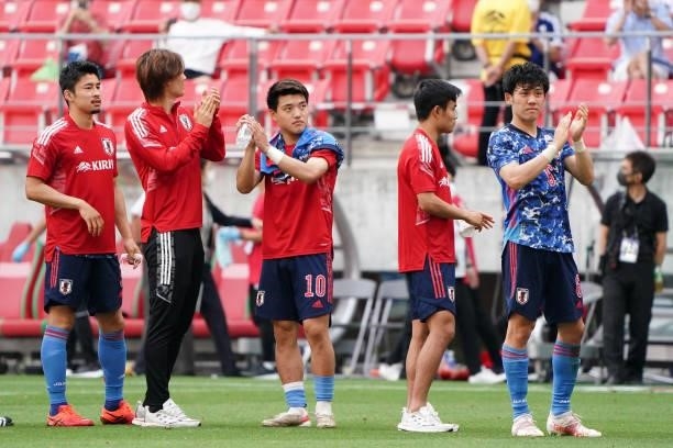 Japanese players applaud fans after their 4-0 victory in the international friendly match between Japan U-24 and Jamaica at the Toyota Stadium on...