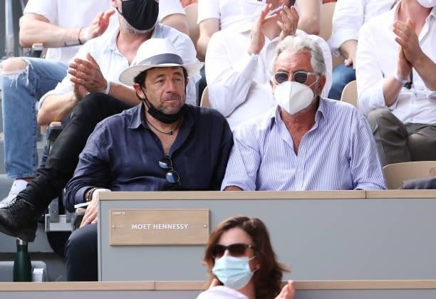 Patrick Bruel, Jean-Paul Enthoven attend the men's semifinals during day 13 of the 2021 Roland-Garros, French Open, a Grand Slam tennis tournament at...