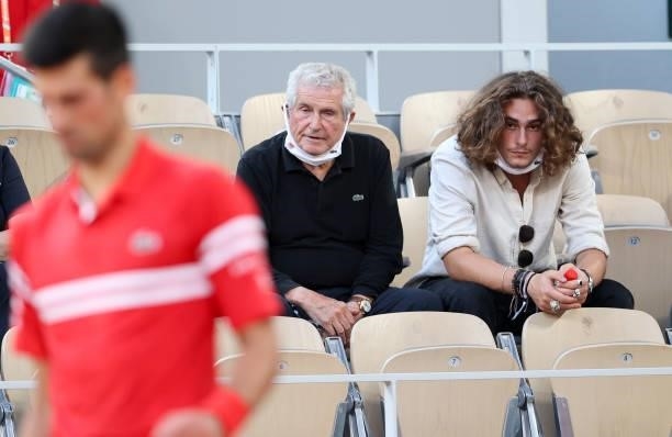 Claude Lelouch and his son Boaz Lelouch - here watching Novak Djokovic of Serbia - attend the men's semifinals during day 13 of the 2021...
