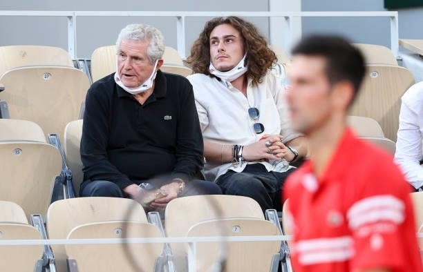 Claude Lelouch and his son Boaz Lelouch - here watching Novak Djokovic of Serbia - attend the men's semifinals during day 13 of the 2021...