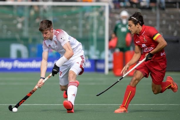 Liam Sanford of England, Thomas Briels of Belgium during the Euro Hockey Championships Men match between England and Belgium at Wagener Stadion on...