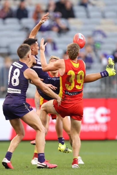 Joel Western of the Dockers contests for a mark during the round 13 AFL match between the Fremantle Dockers and the Gold Coast Suns at Optus Stadium...