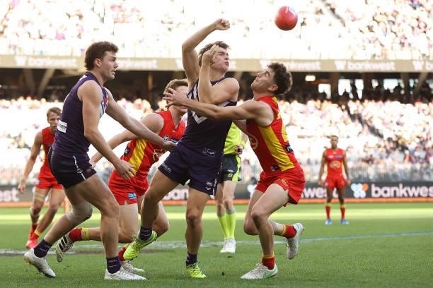 Caleb Serong of the Dockers handballs during the round 13 AFL match between the Fremantle Dockers and the Gold Coast Suns at Optus Stadium on June...