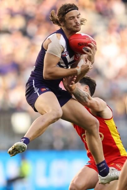 James Aish of the Dockers marks the ball during the round 13 AFL match between the Fremantle Dockers and the Gold Coast Suns at Optus Stadium on June...