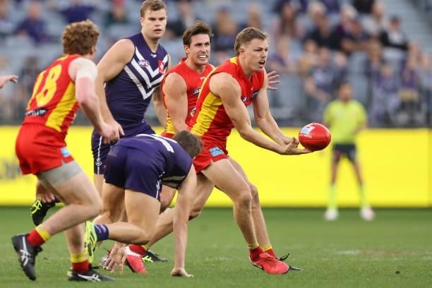 Nick Holman of the Suns in action during the round 13 AFL match between the Fremantle Dockers and the Gold Coast Suns at Optus Stadium on June 12,...