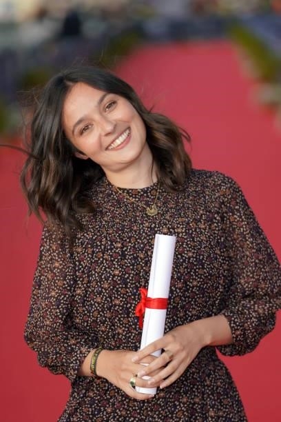 Tiphaine Haas poses with award of best actress as she attends the 35th Cabourg Film Festival - Day Three on June 11, 2021 in Cabourg, France.