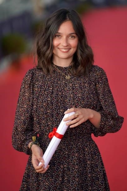 Tiphaine Haas poses with award of best actress as she attends the 35th Cabourg Film Festival - Day Three on June 11, 2021 in Cabourg, France.