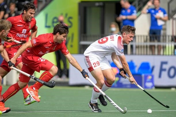 Arthur de Sloover of Belgium, Thomas Sorsby of England during the Euro Hockey Championships Men match between England and Belgium at Wagener Stadion...