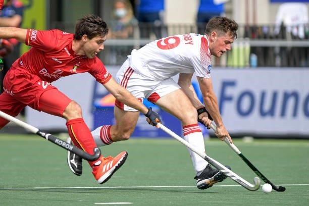 Arthur de Sloover of Belgium, Thomas Sorsby of England during the Euro Hockey Championships Men match between England and Belgium at Wagener Stadion...