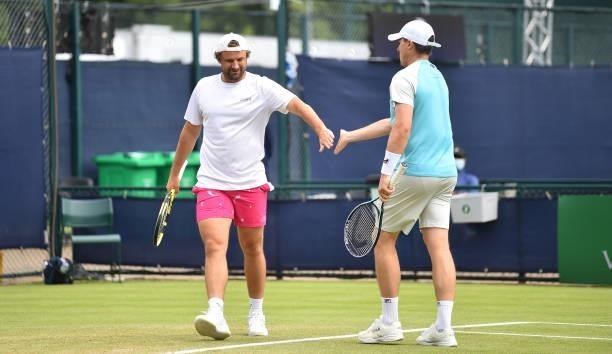 Matt Reid of Australia and Ken Skupski of Great Britain react as they win a point in the Viking Open doubles final match between Matthew Ebden and...