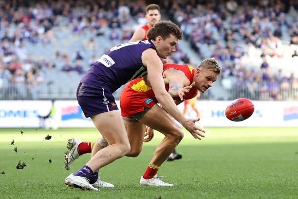 Blake Acres of the Dockers and Brandon Ellis of the Suns contest for the ball during the round 13 AFL match between the Fremantle Dockers and the...