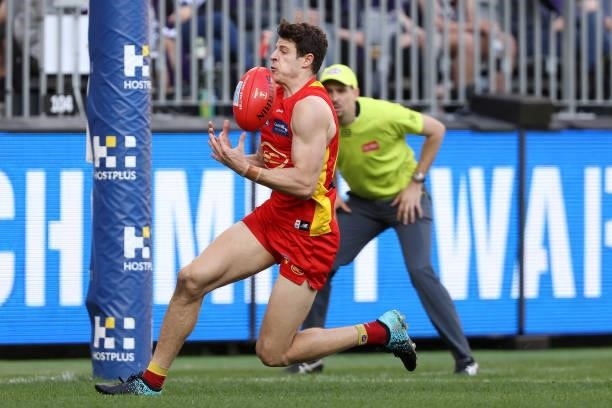 Chris Burgess of the Suns marks the ball during the round 13 AFL match between the Fremantle Dockers and the Gold Coast Suns at Optus Stadium on June...