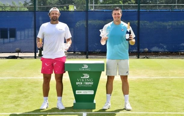 Matt Reid of Australia and Ken Skupski of Great Britain pose with the Viking Nottingham Mens Doubles Trophy on day eight after at Nottingham Tennis...