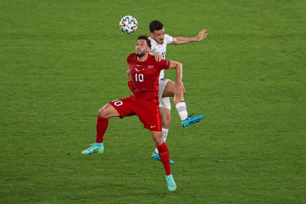 Hakan Calhanoglu of Turkey, Alessandro Florenzi of Italy during the UEFA Euro 2020 Group A match between Turkey and Italy at Stadio Olympico on June...