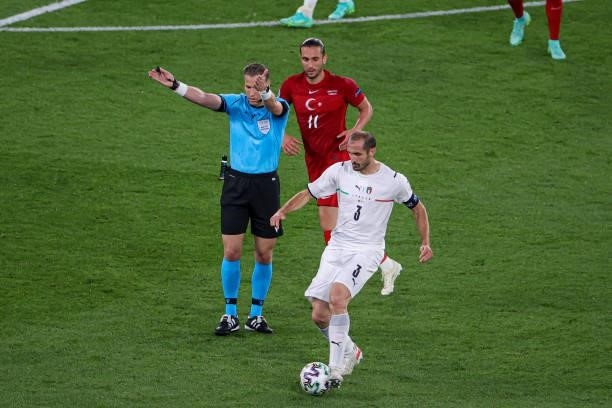 Referee Danny Makkelie, Yusuf Yazici of Turkey, Giorgio Chiellini of Italy during the UEFA Euro 2020 Group A match between Turkey and Italy at Stadio...