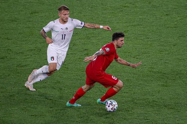 Ciro Immobile of Italy, Ozan Tufan of Turkey during the UEFA Euro 2020 Group A match between Turkey and Italy at Stadio Olympico on June 11, 2021 in...