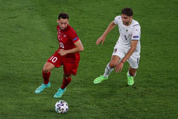 Hakan Calhanoglu of Turkey, Manuel Locatelli of Italy during the UEFA Euro 2020 Group A match between Turkey and Italy at Stadio Olympico on June 11,...