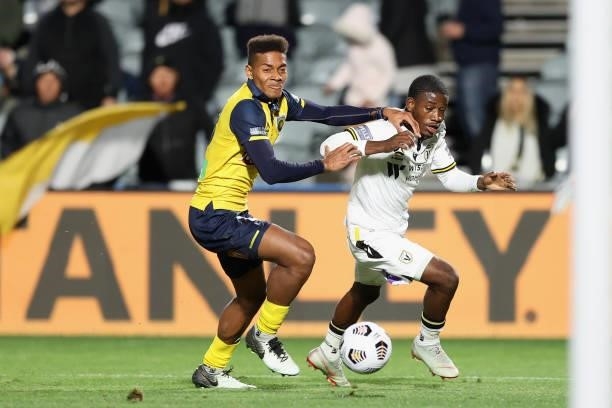 Daniel Hall of the Mariners contests the ball against Moudi Najjar of Macarthur during the A-League Elimination Final match between Central Coast...