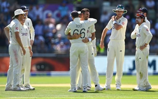 England bowler James Anderson celebrates with Joe Root and team mates after taking the wicket of Neil Wagner during day three of the second LV=...