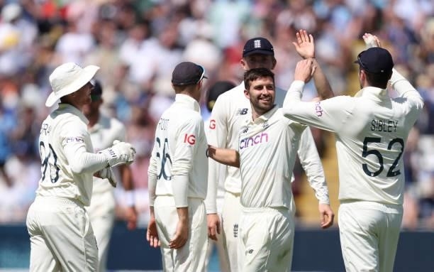 England bowler Mark Wood celebrates with team mates after taking the wicket of Matt Henry during day three of the second LV= Insurance Test Match...