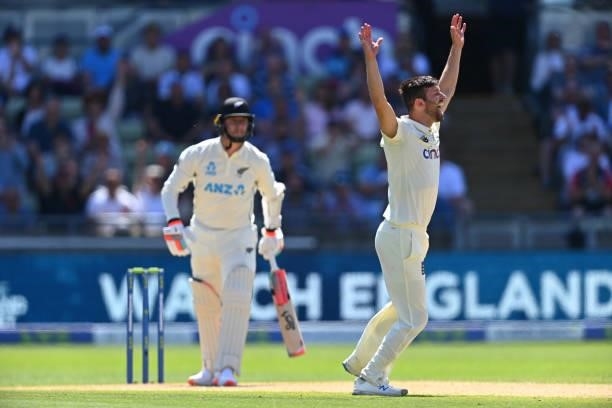 England bowler Mark Wood celebrates after taking the wicket of Matt Henry for 12 runs during day three of the second LV= Insurance Test Match between...