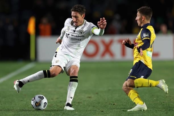 Mark Milligan of Macarthur is contested by Joshua Nisbet of the Mariners during the A-League Elimination Final match between Central Coast Mariners...