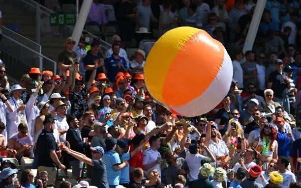 An inflatable Beach Ball is thrown around the Hollies Stand by amused spectators during day three of the second LV= Insurance Test Match between...