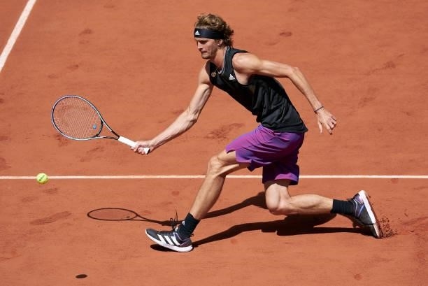 Alexander Zverev of Germany returns a ball in his Semi Final match against Stefanos Tsitsipas of Greece during day thirteen of the 2021 French Open...