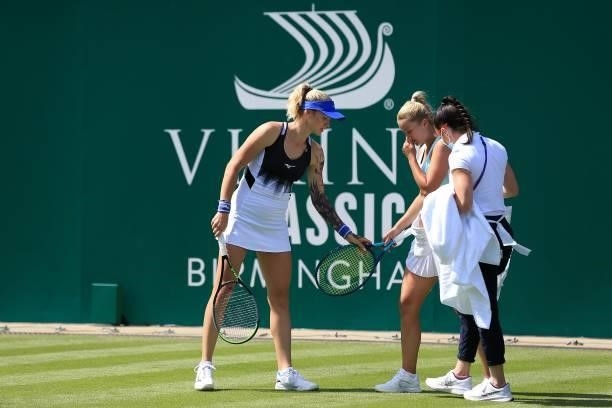 Dalila Jakupovic of Slovakia is helped up by Tereza Martincova of Czech Republic after slipping in qualifying during the Viking Classic Birmingham at...