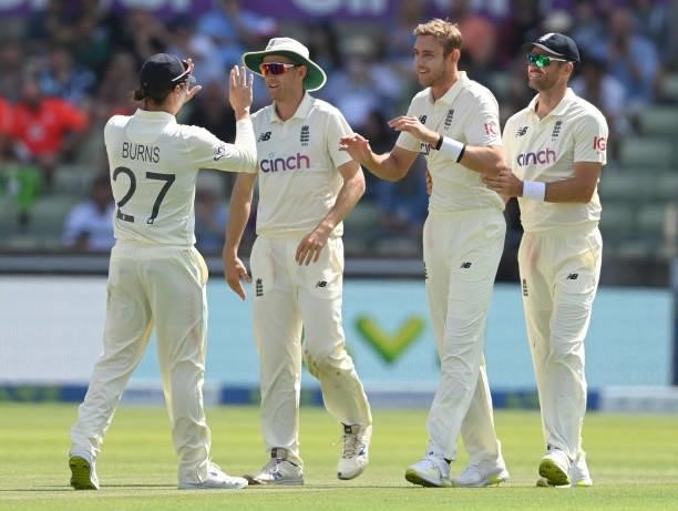 Stuart Broad of England is congratulated by James Anderson, Olly Stone and Rory Burns after dismissing Tom Blundell of New Zealand during the third...