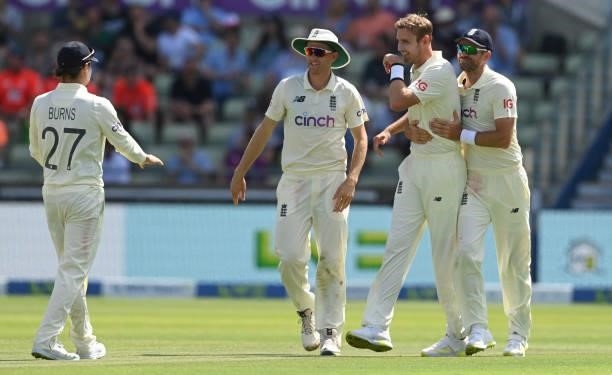 Stuart Broad of England is congratulated by James Anderson, Olly Stone and Rory Burns after dismissing Tom Blundell of New Zealand during the third...
